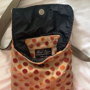 Midi Queen tan square button-close purse with multi-color polka dots